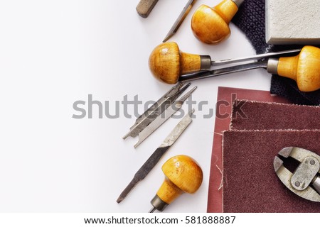 Scribing tools and equipment for manual metal engraving.