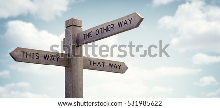 Crossroad signpost saying this way, that way, the other way concept for lost, confusion or decisions Royalty-Free Stock Photo #581985622