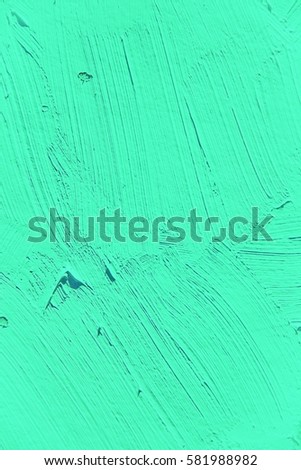 Painting close up of vivid turquoise light green color, paint brush strokes  texture for interesting, creative, imaginative backgrounds. For web and design.
