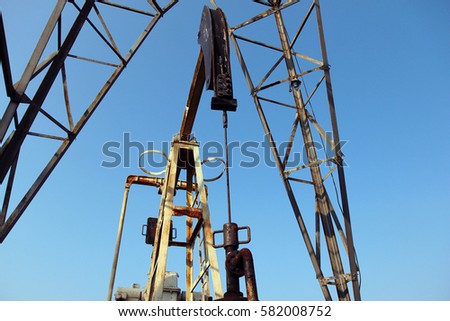 oil and gas industry. Crude oil mining pump under blue sky
