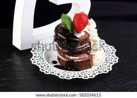 Chocolate yule log christmas cake. Valentine day cake with strawberry