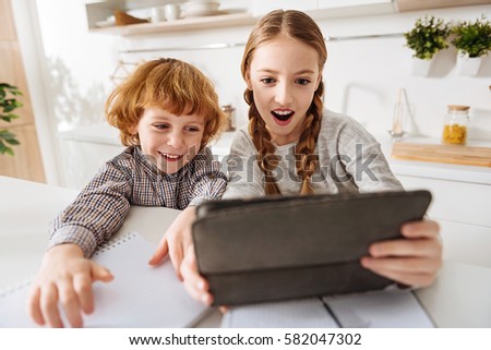 Excited funny children taking a selfie