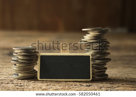 stack of coins with wooden tag ,for business and financial concept
