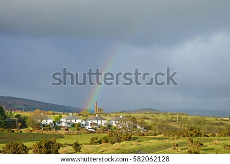 A partial rainbow over the Prince of Wales Engine house and panorama view of Bodmin Moor at Minions, Cornwall, United Kingdom