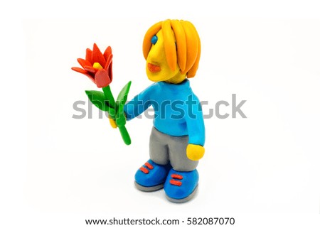 Toy man with red flower