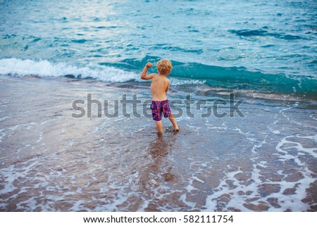 Small boy and sea