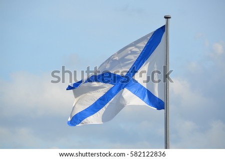 The Russian Navy Ensign , also known as the St Andrews's flag, was the ensign of the Navy of the Russian Empire (from 1712 to 1918), and is the naval flag of the Russian Federation since 1992 Royalty-Free Stock Photo #582122836