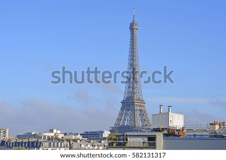 Iconic Eiffel Tower in Paris on a bright sunny day