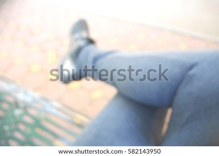 Picture blurred  for background abstract and can be illustration to article of sit with one's legs crossed