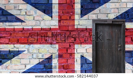 British flag painted on an old brick wall. Closed door in a wall
