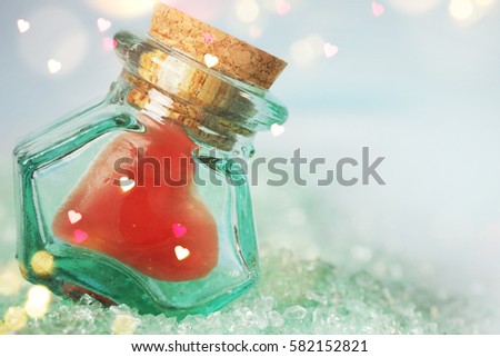 Heart Candy in the small bottle. Spring background. Greeting card for Mother's Day, 8 March, Birthday, Teacher's Day