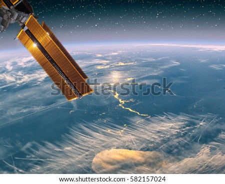 Spaceship against earth on the background. Outer space. "The elements of this image furnished by NASA"
