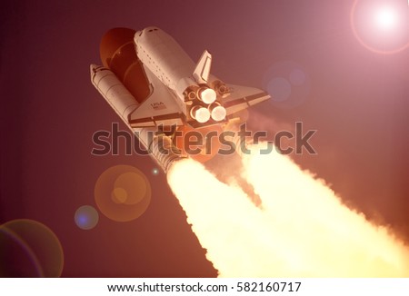 Spaceship launch in clouds. Star rocket launch. "The elements of this image furnished by NASA"
 Royalty-Free Stock Photo #582160717