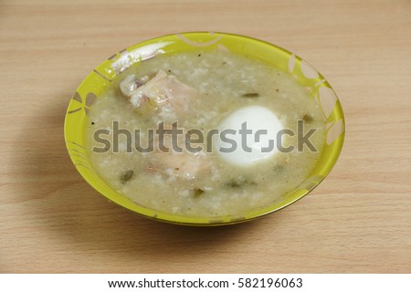 Arroz Caldo  literally means warm rice soup is a type of congee and a popular street food in the Philippines. It usually contains chicken, egg, glutenous rice and ginger-based broth