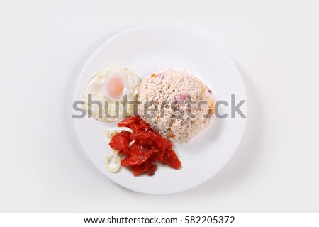 Tosilog Filipino Street Food. Made of Tocino Spanish style bacon with egg and fried rice locally known in the Philippines as sinangag. Flat Lay Shot.