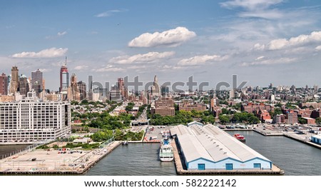 Docks of New York City, aerial view with city skyline.
