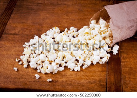 Fresh salty popcorn in package
