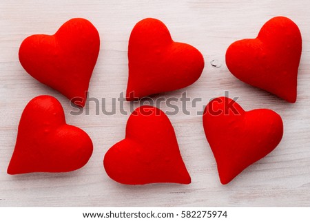 Red hearts the gray background. Valentine Day background.