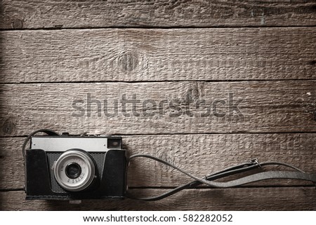 photography background with old camera and wooden table