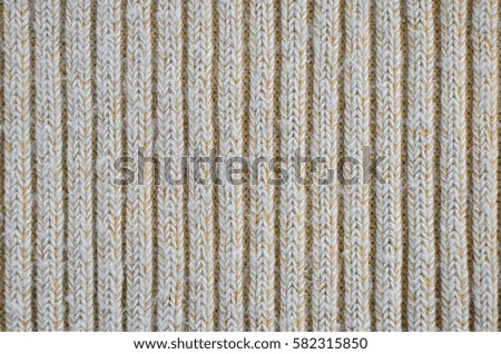 Fabric texture. Cloth knitted, cotton, wool background. Close-up of seamless gray knitted fabric material