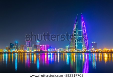 Skyline of Manama dominated by the World trade Center building during night, Bahrain. Royalty-Free Stock Photo #582319705