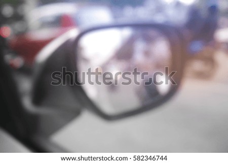 Picture blurred  for background abstract and can be illustration to article of side rear view mirror on a car