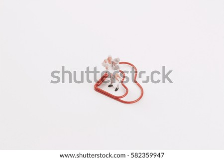 tiny of wedding figure with paper clip