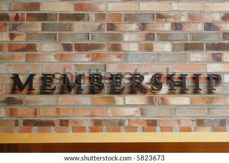 Membership Sign on Brick Wall