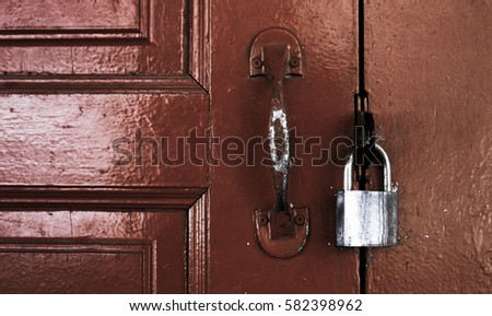 old door with handle and door lock.