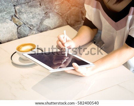 Woman play mobile,tablet  App Development Concept with Doodle design style :Hand drawn  set of social media sign and symbol mobile elements.color lighting effect.