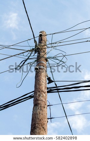 pole for electric wires on a background of blue sky