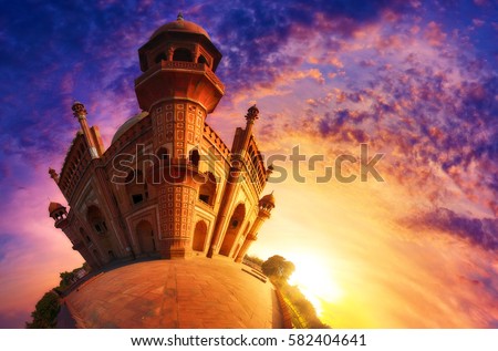 Small world photography of Mughal heritage monument Safdarjung Tomb, New Delhi at the sunset. Reminiscent of Agrabah from cartoon series, Aladdin. Royalty-Free Stock Photo #582404641
