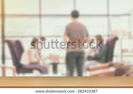 Blurred of People sit drinking coffee and talking in a cafe for backgound with Perspective wood