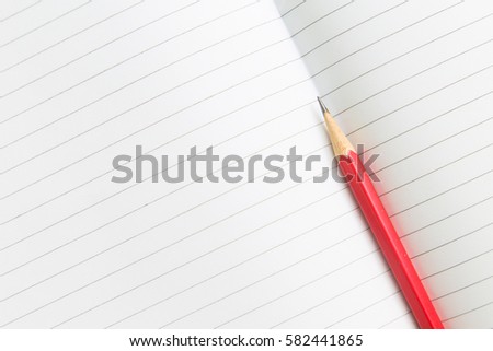 Blank opened notebook with pencil.