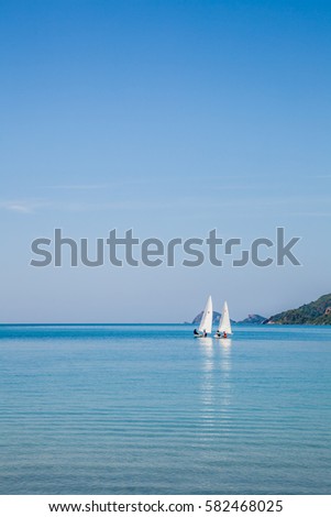 Boat in the sea on blue sky background