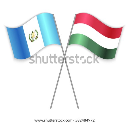 Guatemalan and Hungarian crossed flags. Guatemala combined with Hungary isolated on white. Language learning, international business or travel concept.