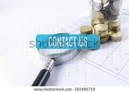 Magnify glass,coins and calculator. Business concept.