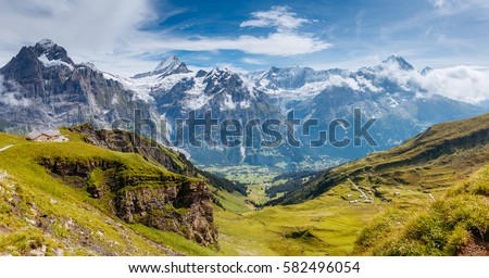 Great view of Eiger village. Picturesque and gorgeous scene. Popular tourist attraction. Location place Swiss alps, Grindelwald valley in the Bernese Oberland, Europe. Discover the world of beauty. Royalty-Free Stock Photo #582496054