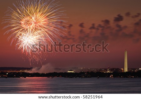 Fireworks celebration over the Washington skyline with Washington Monument visible.