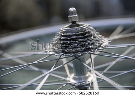 Close-up of a brand new and shiny bicycle wheel with gears