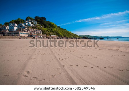 Looe Cornwall beach sunny summer day Royalty-Free Stock Photo #582549346