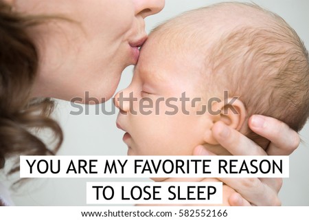 Funny newborn babe napping in mom arms. Young mother kissing sleeping adorable new born child on the forehead. Close-up. Photo with motivational text "You are my favorite reason to lose sleep" 