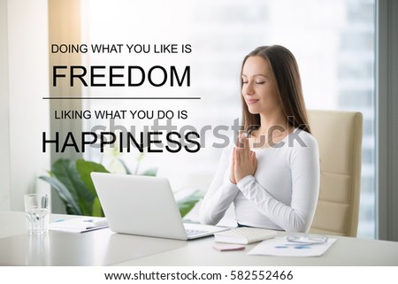 Fit business woman doing online yoga or pilates exercise in office. Fitness motivation quote with motivational text "Doing what you like is freedom, liking what you do is happiness". Healthy concept
