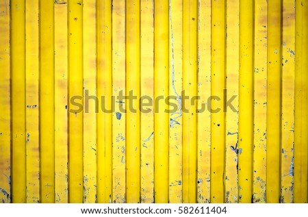Yellow shipping container background texture Royalty-Free Stock Photo #582611404
