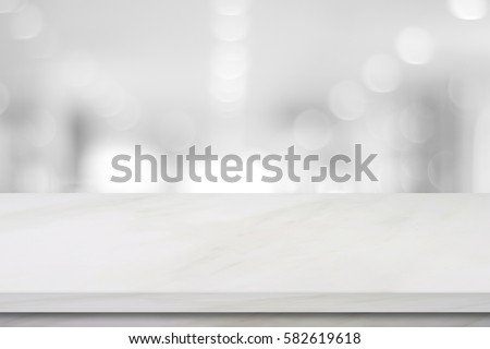 White table top, counter perspective background, Empty white marble shelf, desk over blur store, shop background, Stone table for product display, Luxury tabletop and blur kitchen for food banner Royalty-Free Stock Photo #582619618