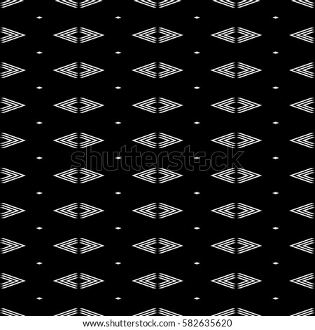 Seamless surface pattern design with diamonds ornament. Lozenge motif. Repeated white rhombuses on black background. Ornamental wallpaper. Digital paper for page fills, web designing, textile print.