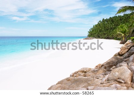 A white-sand beach on Fregate Island, an ultra-exclusive Indian Ocean resort in the Seychelles. Royalty-Free Stock Photo #58265