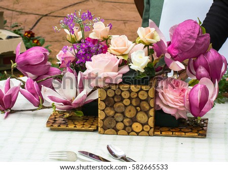 Beautiful flower arrangement on table at some public agriculture station.