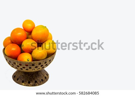 Put a small orange in coconut shells.