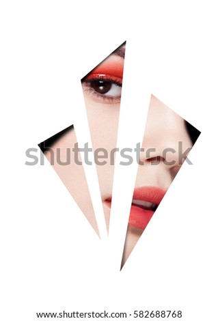 Beauty red eyes and lips makeup fashion model on black background looking through three white triangles. Creative artwork